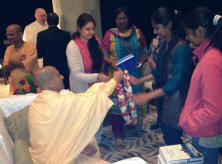 Radhanath Swami giving Garland