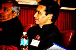 Dr Navin Mehta listening intently to Radhanath Swami 