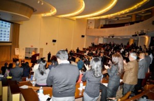 Participants giving a standing ovation at the conclusion of the  Keynote Address by Radhanath Swami 